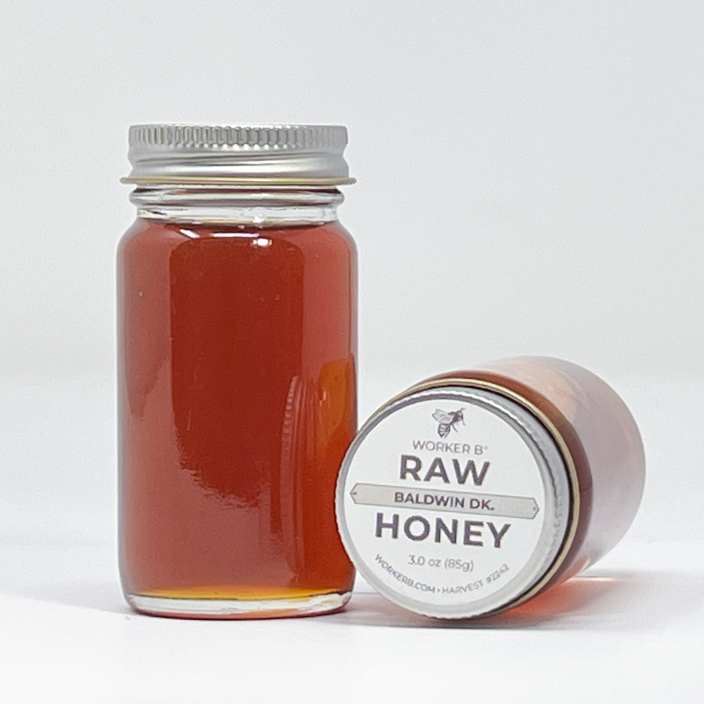 Jar of honey with a label on a white background