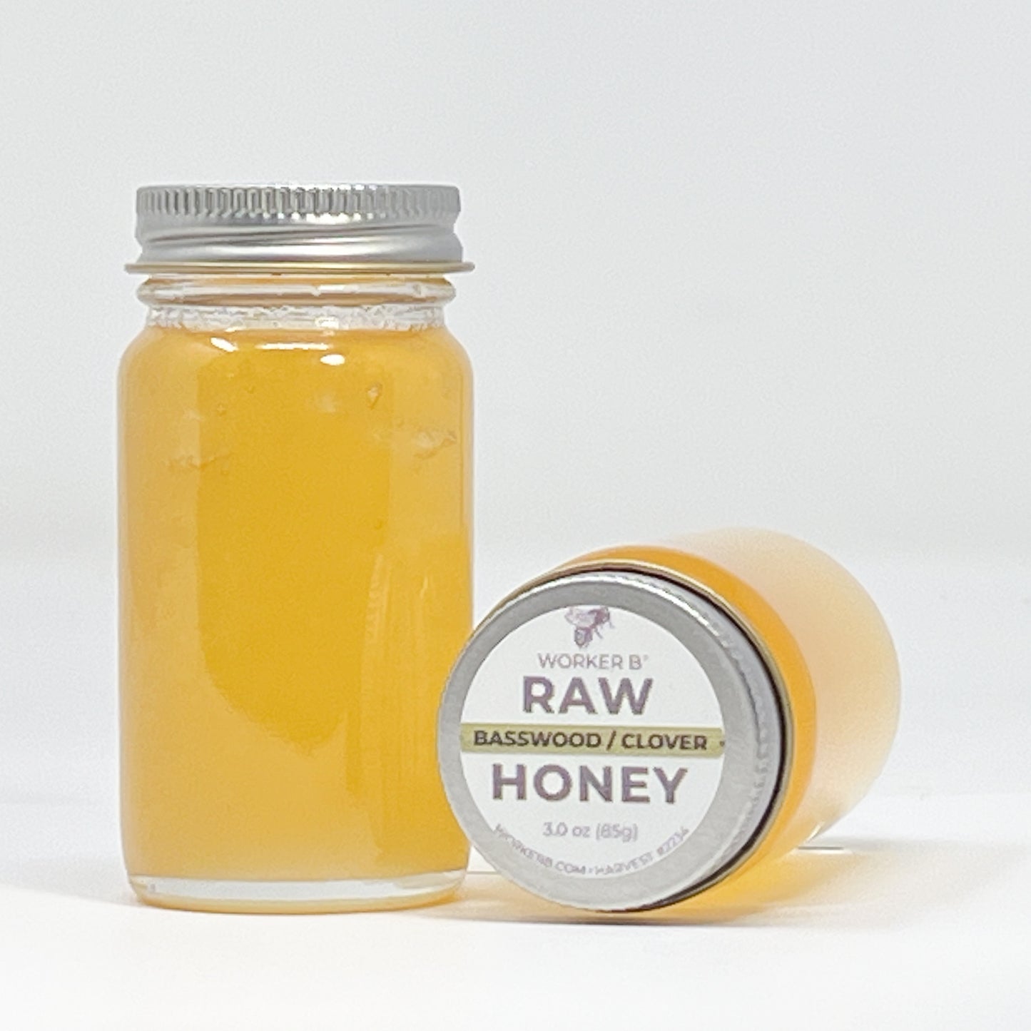 Jar of honey with a label on a white background