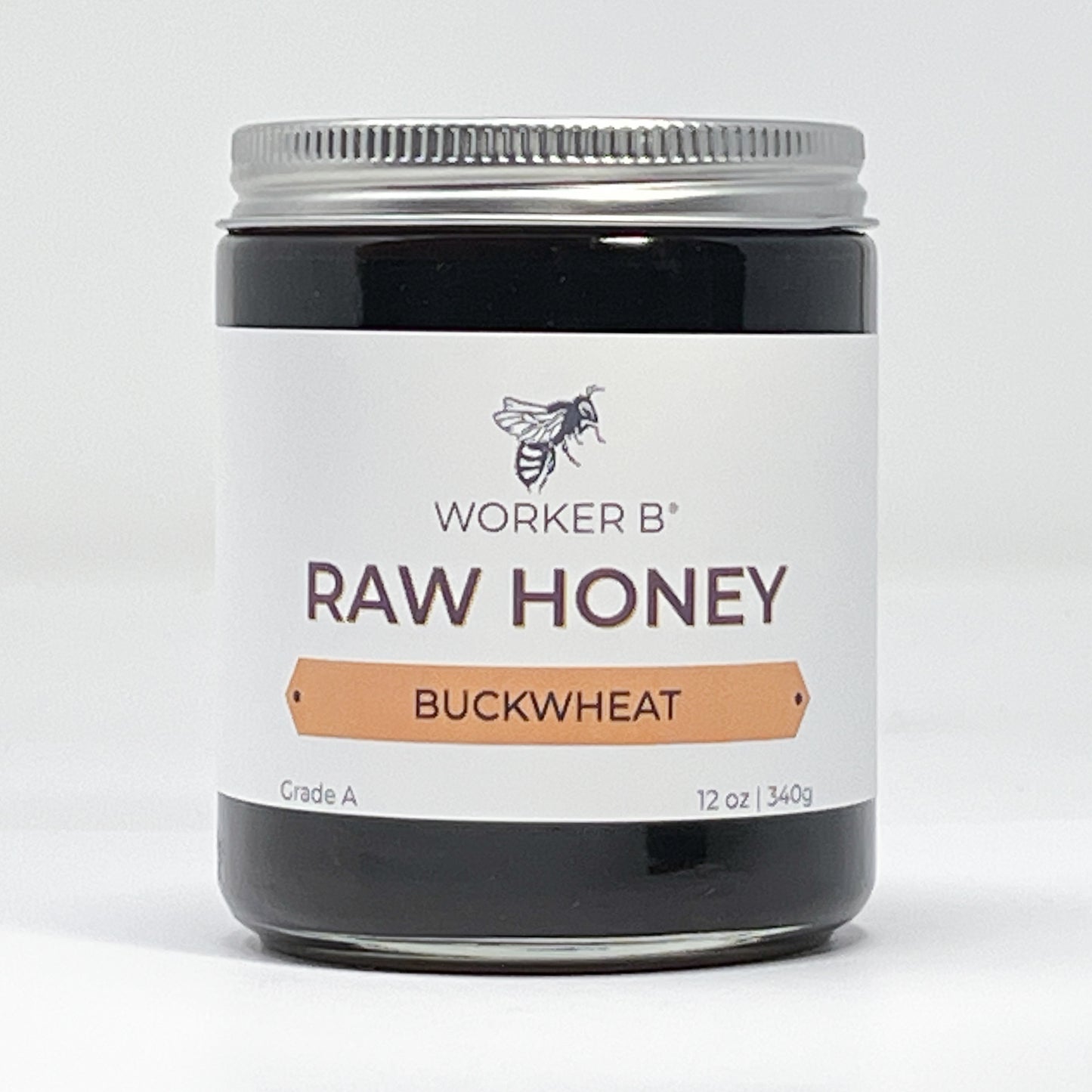 Jar of Worker B Raw Honey Buckwheat on a white background