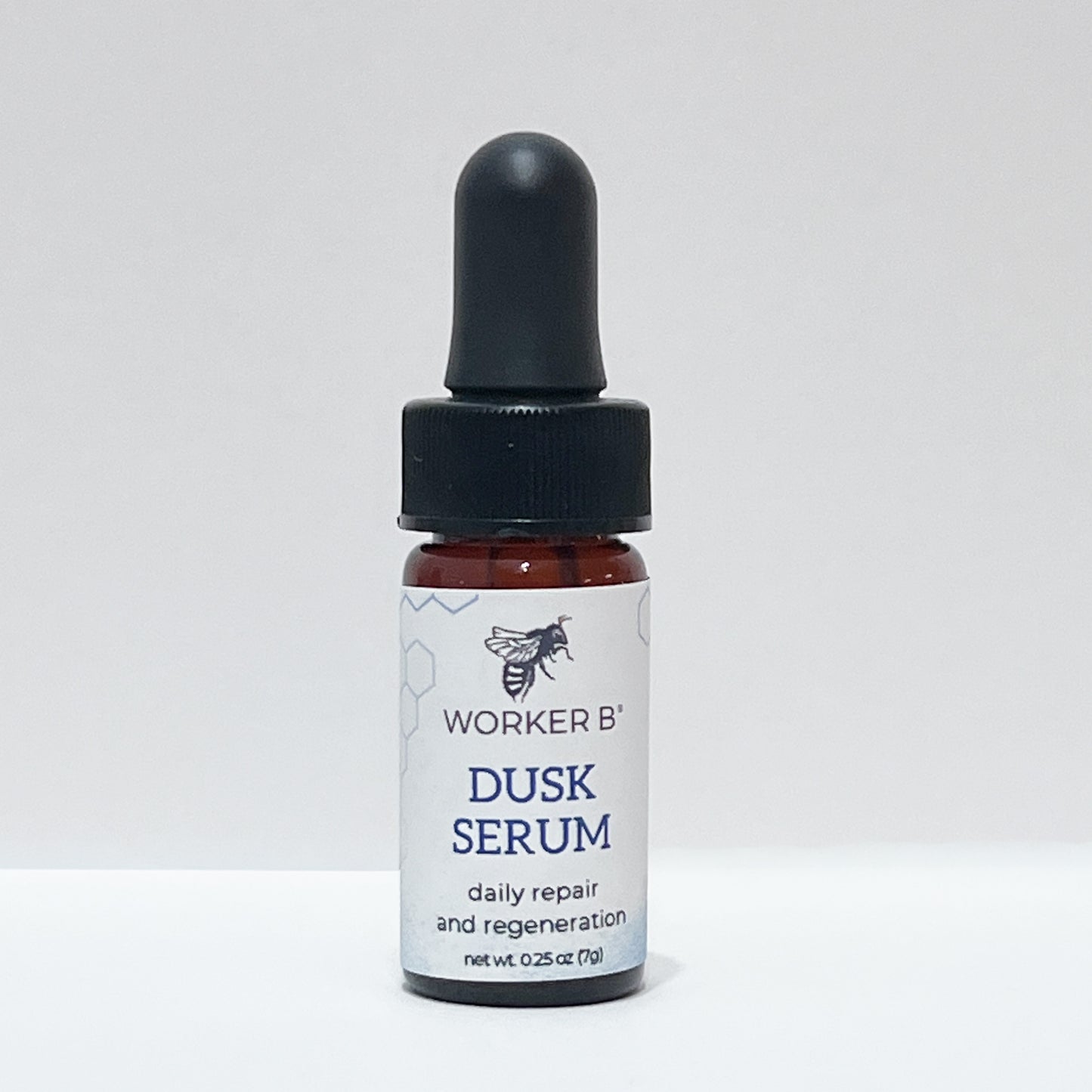 Bottle of Worker B' Dusk Serum on a white background