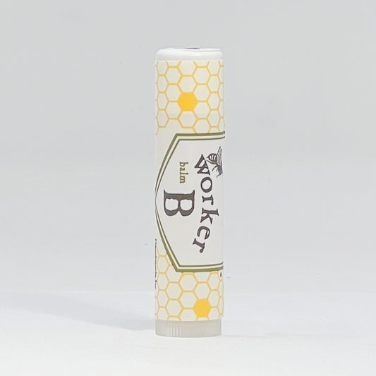 Lip balm with honeycomb design and 'Worker B' branding on a gray background