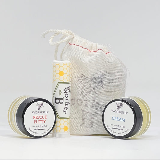 Worker B skincare products including a jar, tube, and cream with a drawstring bag on a light gray background.