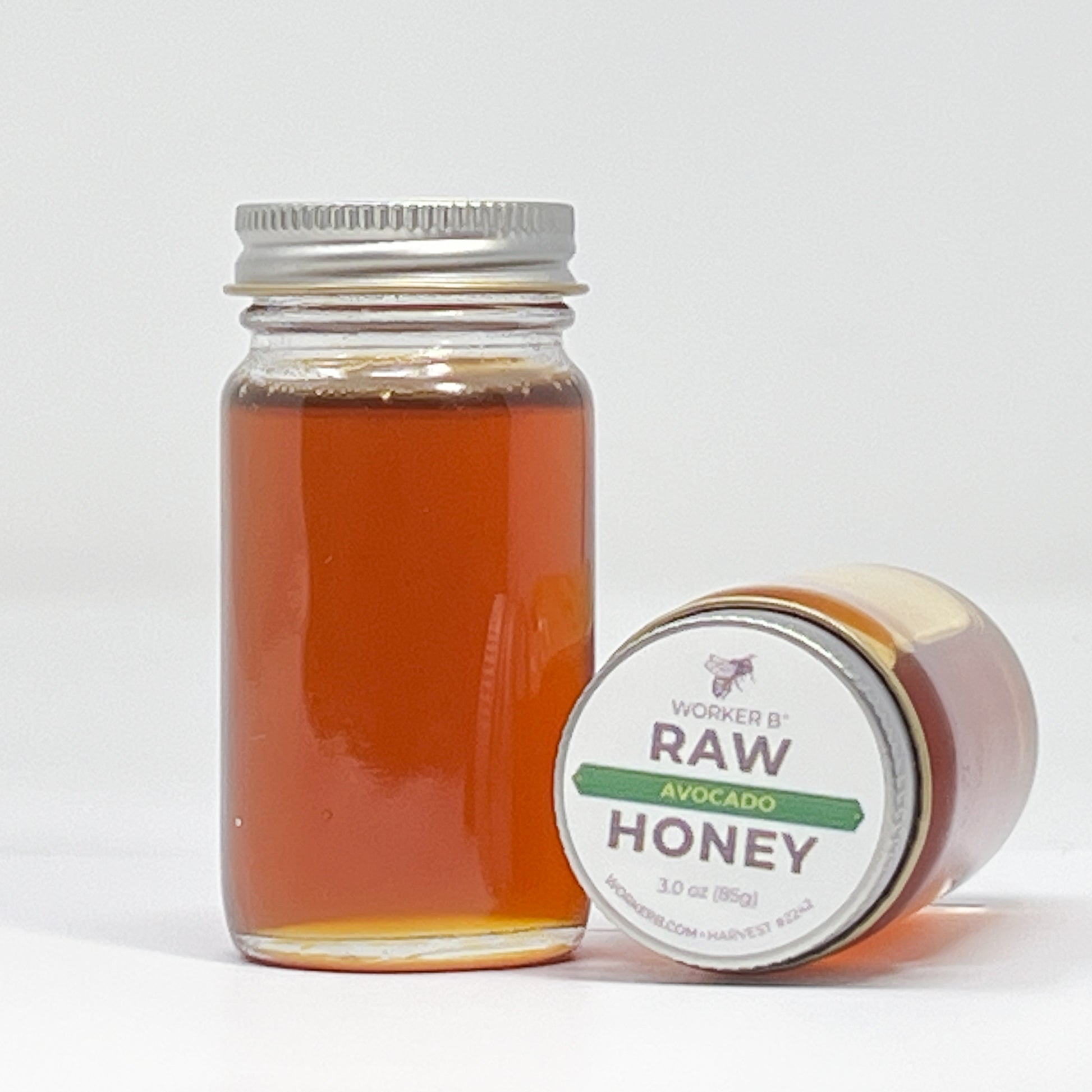 Jar of honey with a label on a white background