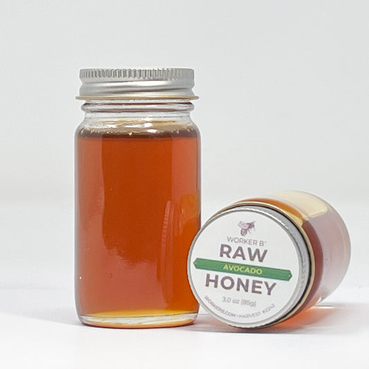 Jar of honey with a label on a white background