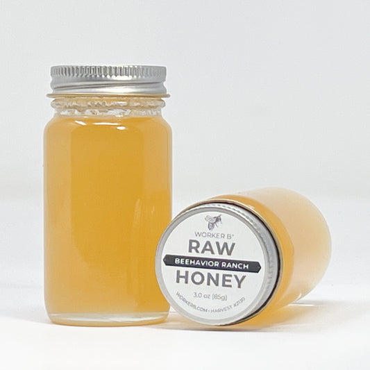 Jar of honey with a label on a white background