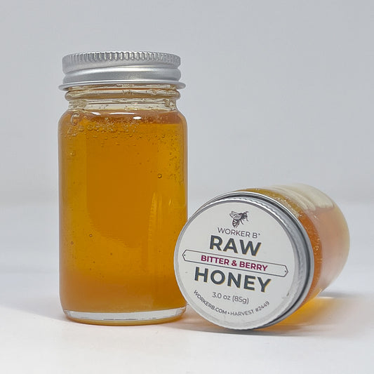 Jar of honey with a label on a white background