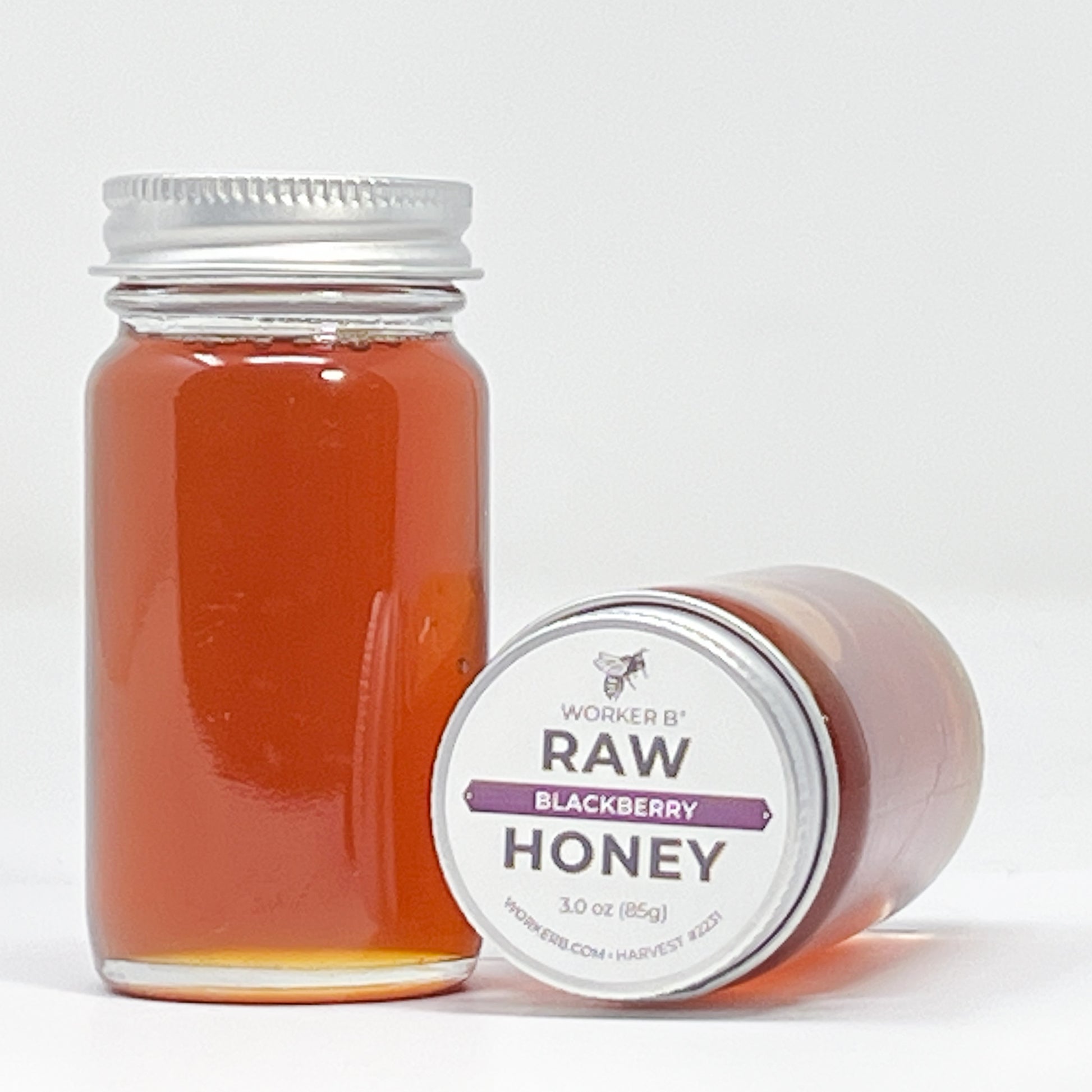 Jar of Worker B Raw Blackberry Honey on a white background