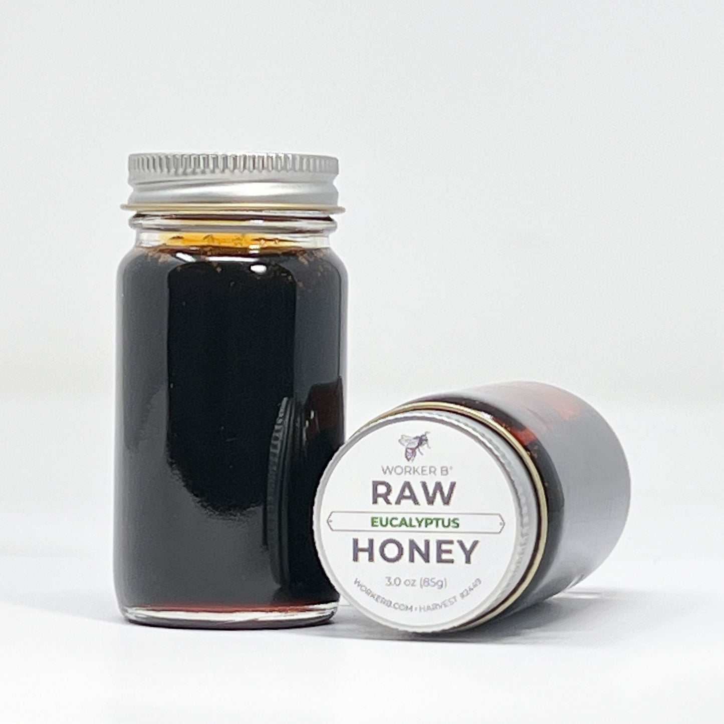 Jar of Worker B Raw Eucalyptus Honey on a white background