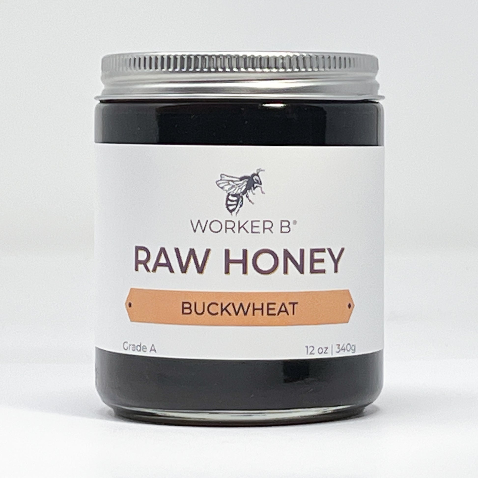 Jar of Worker B Raw Honey Buckwheat on a white background