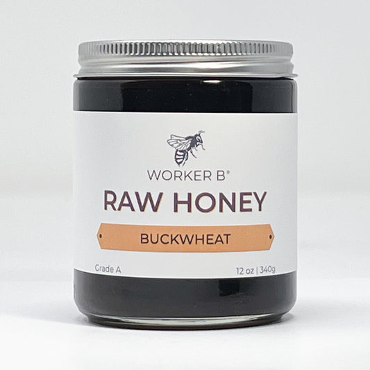 Jar of Worker B Raw Honey Buckwheat on a white background