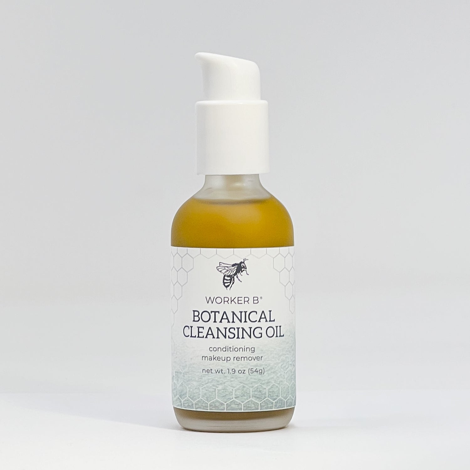 Bottle of Worker B Botanical Cleansing Oil on a light gray background