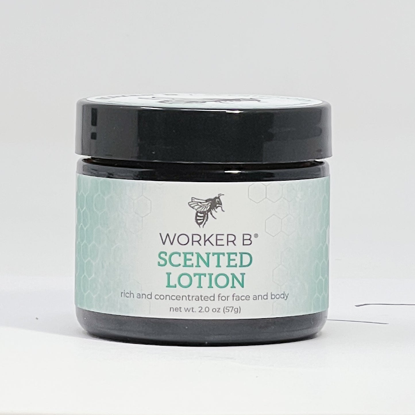 Jar of Worker B scented lotion on a white background