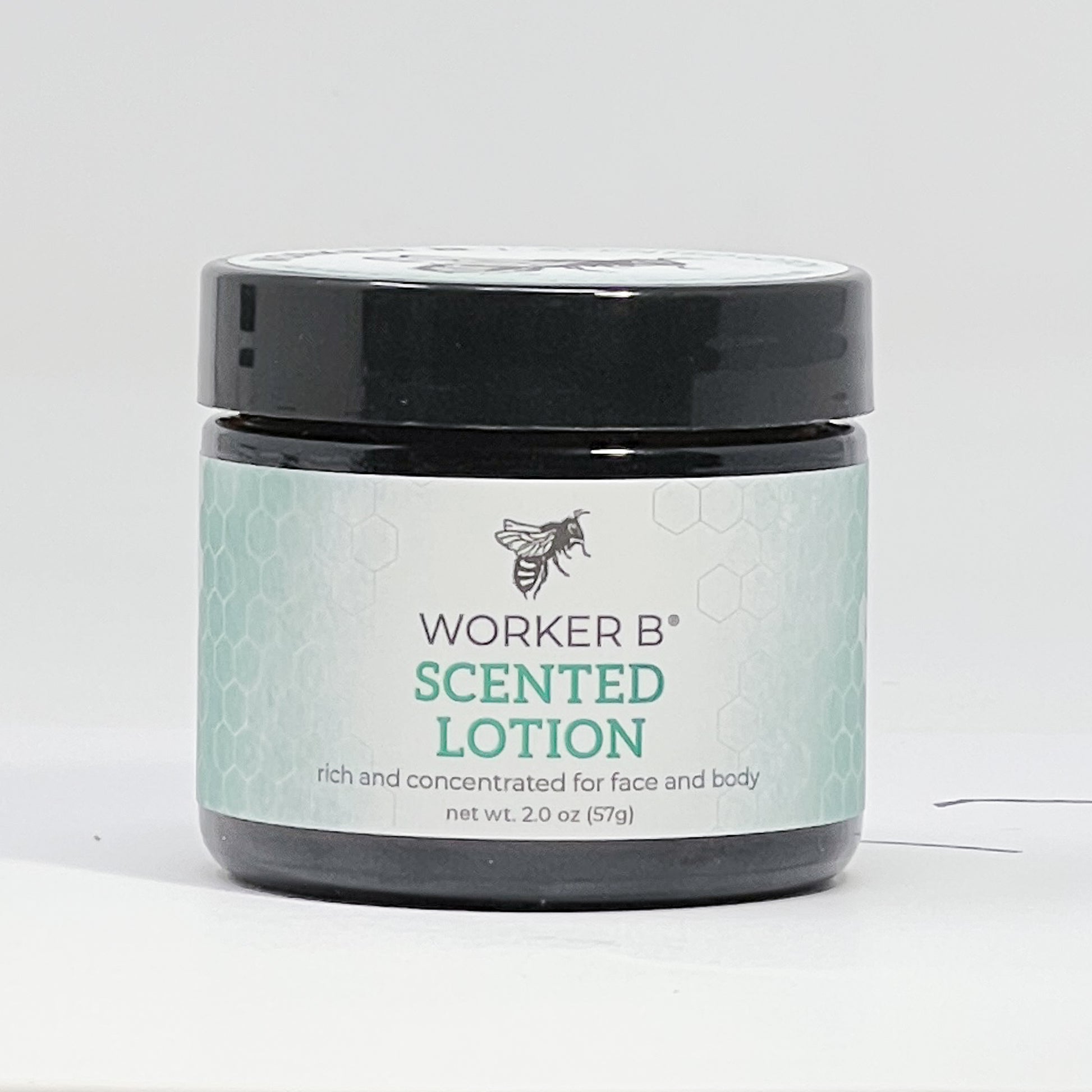 Jar of Worker B scented lotion on a white background