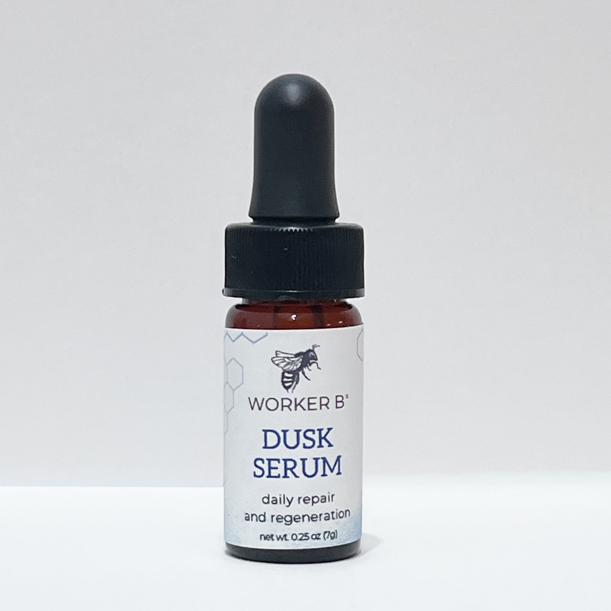 Bottle of Worker B' Dusk Serum on a white background
